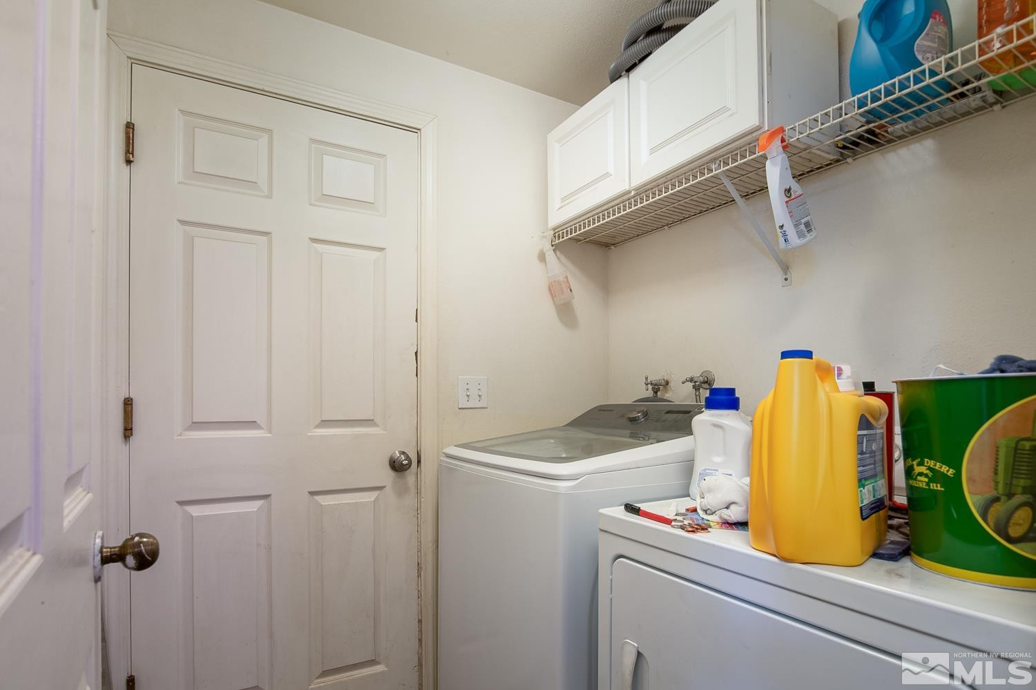 574 Yellow Jacket Road Dayton, NV 89403 - Photo 17 of 37 a utility room with sink dryer and washer