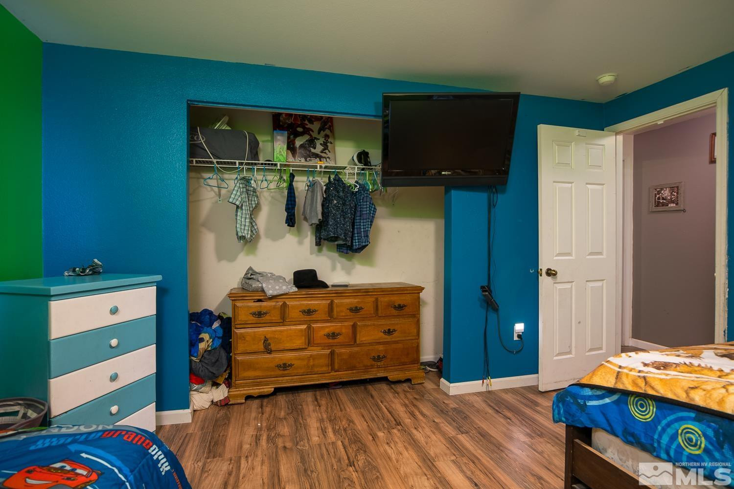 574 Yellow Jacket Road Dayton, NV 89403 - Photo 19 of 37 a bedroom with a bed and a dresser