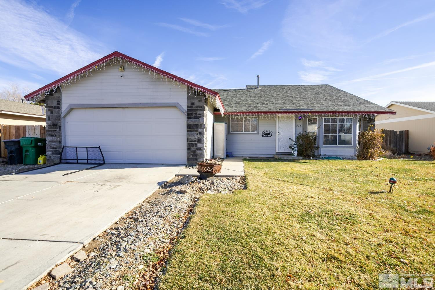 574 Yellow Jacket Road Dayton, NV 89403 - Photo 2 of 37 a front view of a house with a yard