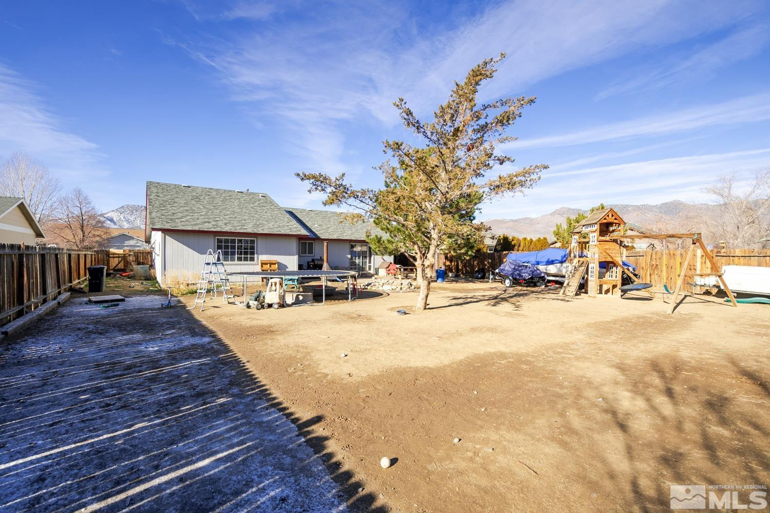 574 Yellow Jacket Road Dayton, NV 89403 - Photo 23 of 37 a swimming pool with outdoor seating and yard