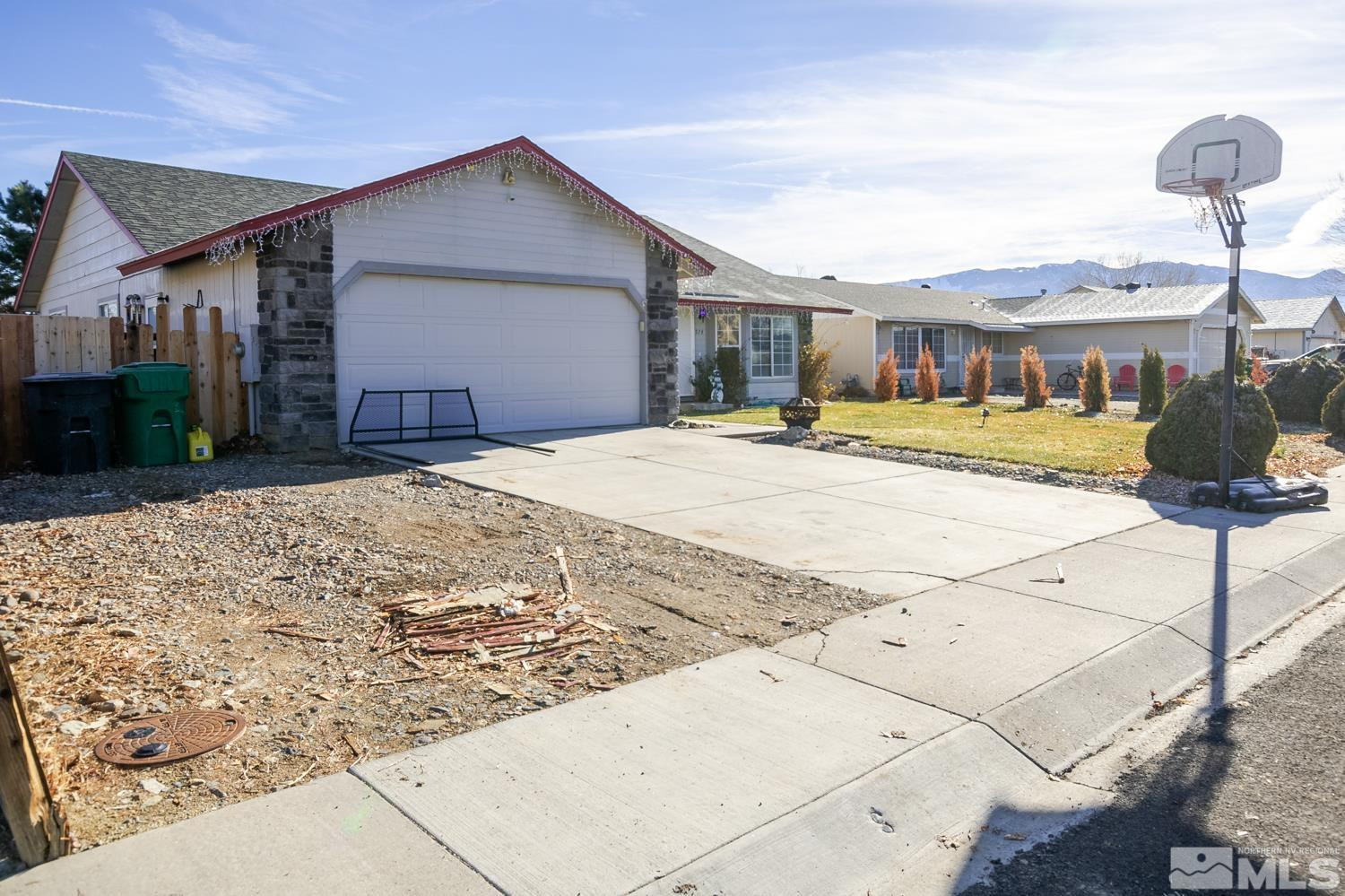 574 Yellow Jacket Road Dayton, NV 89403 - Photo 3 of 37 a front view of a house with a yard