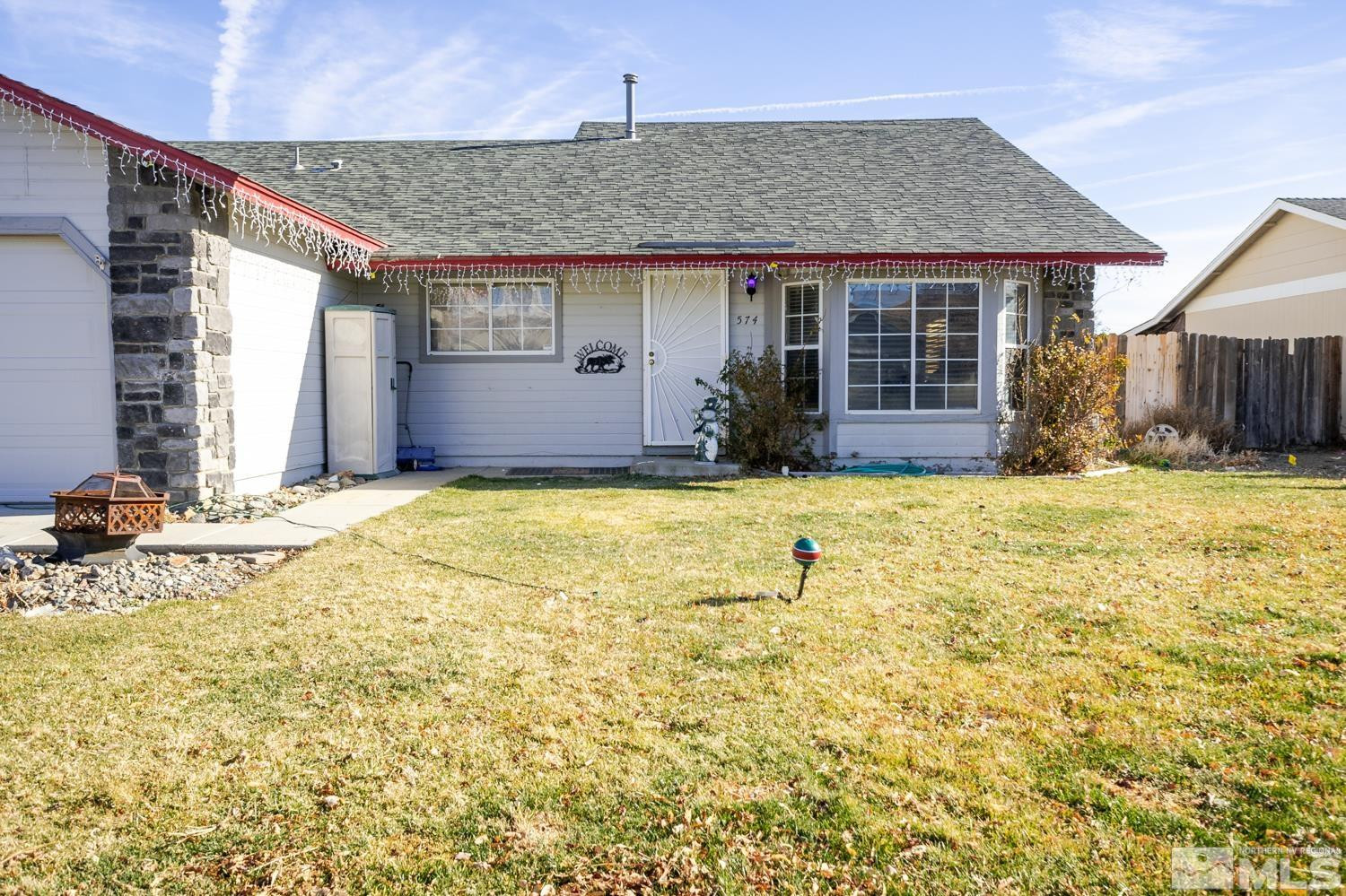 574 Yellow Jacket Road Dayton, NV 89403 - Photo 4 of 37 a view of a house with a yard