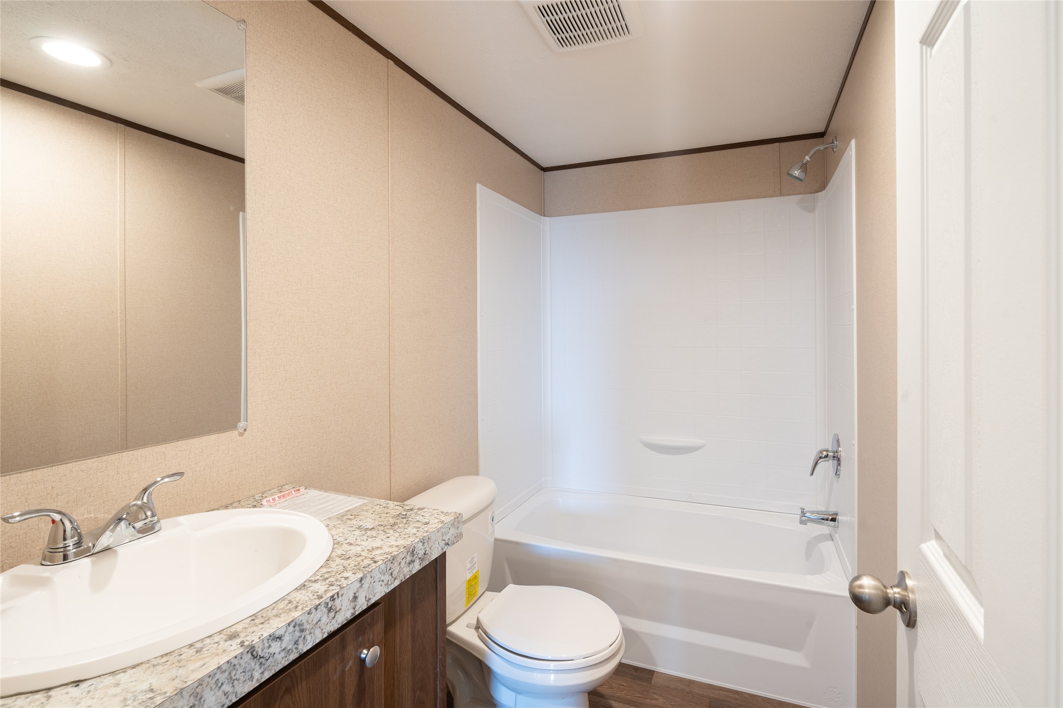 6945 Seawillow Road Lockhart, TX 78644 - Photo 12 of 21 a bathroom with a granite countertop sink toilet and shower