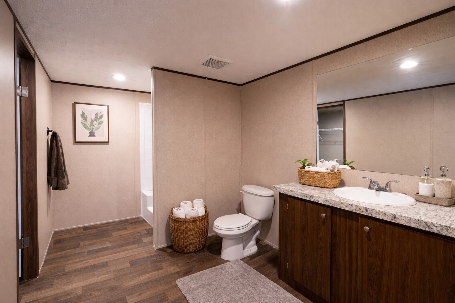 6945 Seawillow Road Lockhart, TX 78644 - Photo 17 of 21 a bathroom with a granite countertop sink a toilet and a mirror