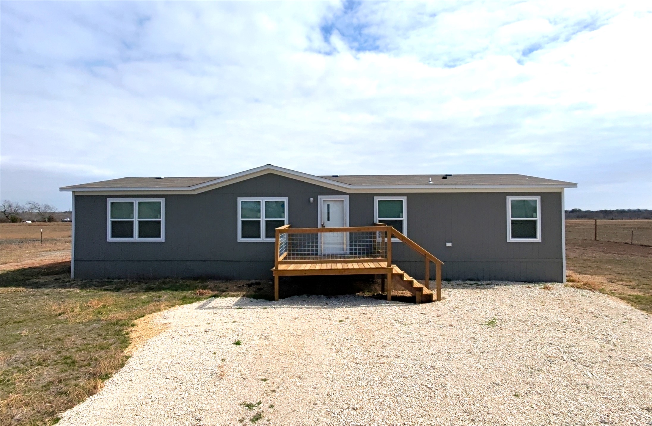 6945 Seawillow Road Lockhart, TX 78644 - Photo 2 of 21 a front view of a house with a yard