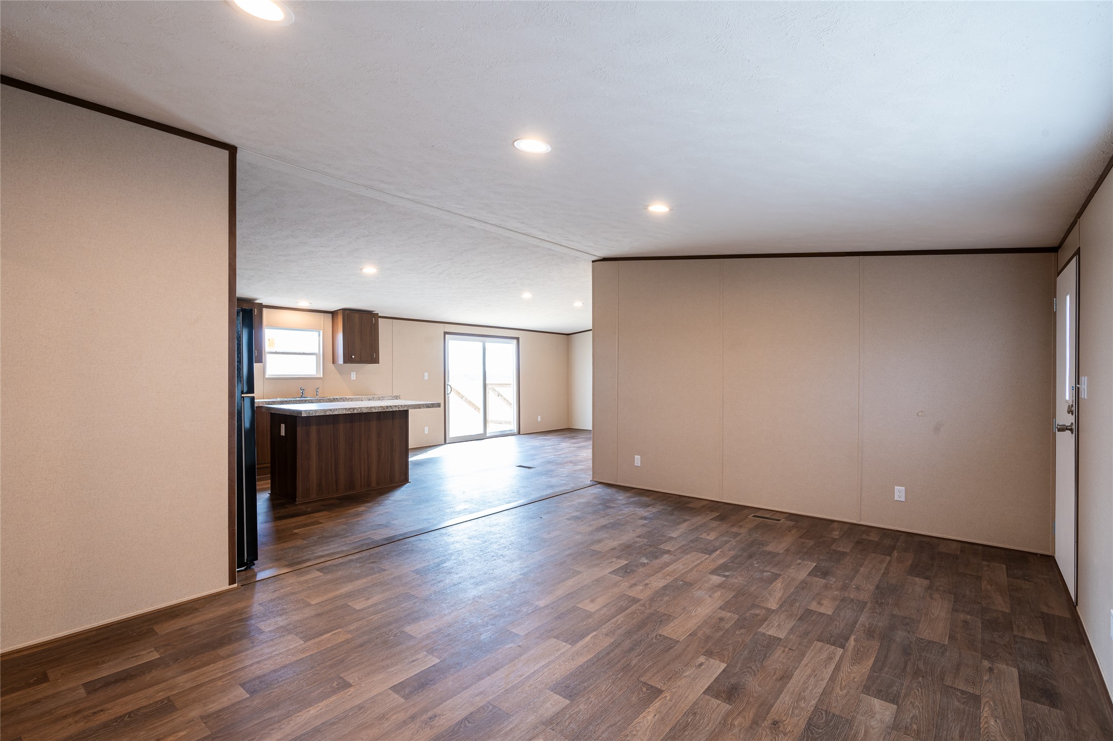 6945 Seawillow Road Lockhart, TX 78644 - Photo 5 of 21 a view of a big room with wooden floor and windows