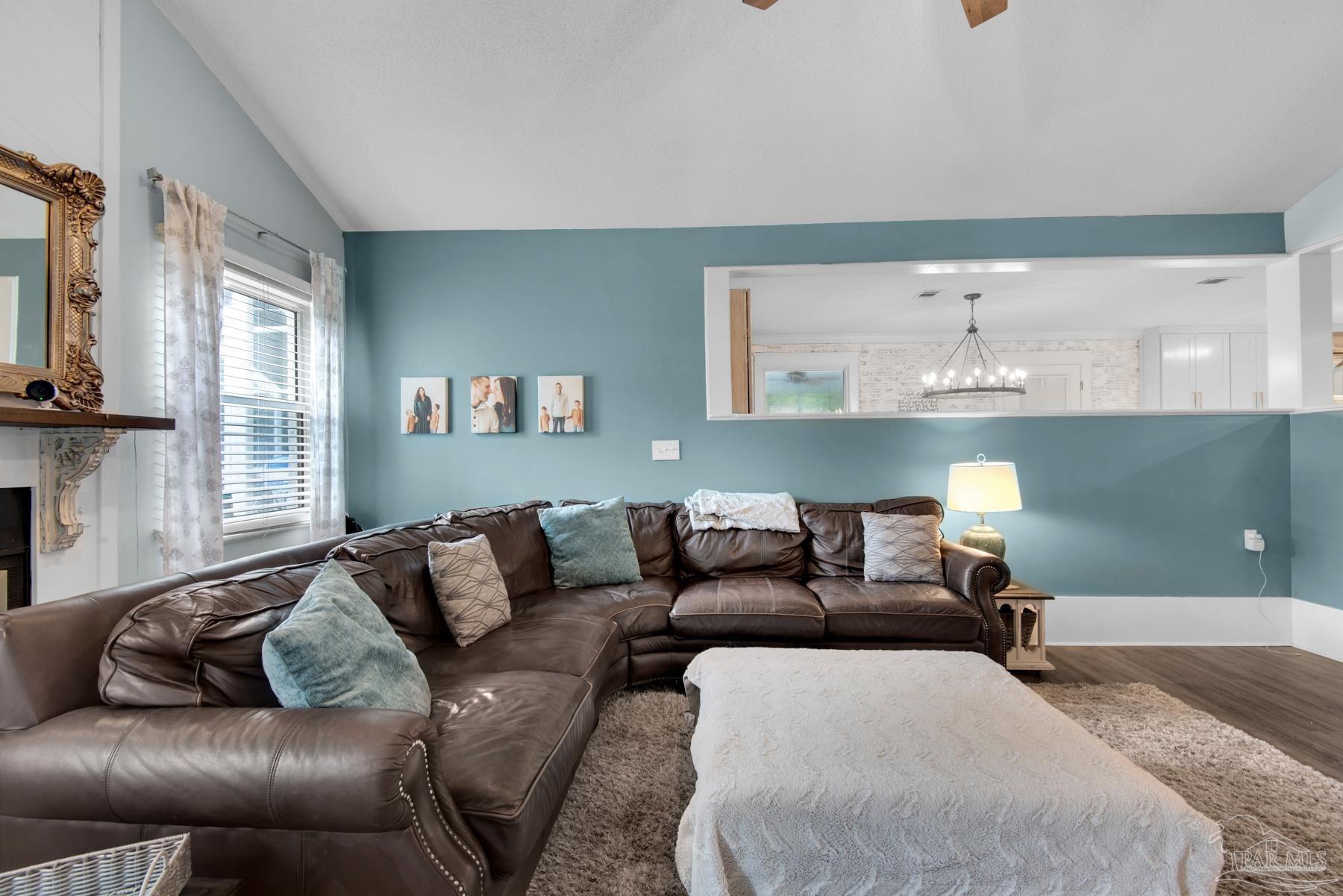 4316 Highland Boulevard Pace, FL 32571 - Photo 11 of 43 a living room with furniture and a couch