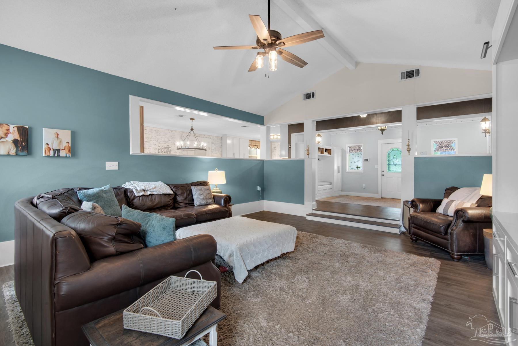 4316 Highland Boulevard Pace, FL 32571 - Photo 12 of 43 a living room with furniture and a chandelier