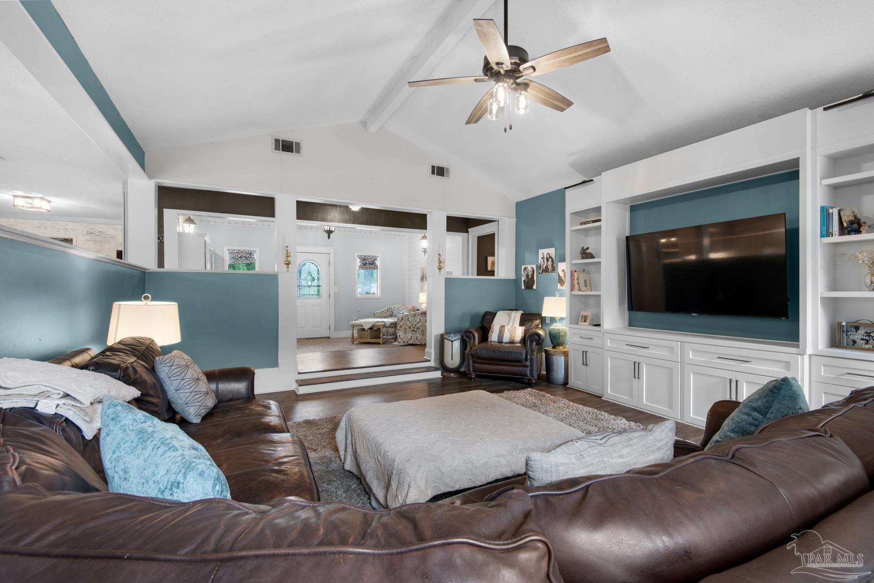 4316 Highland Boulevard Pace, FL 32571 - Photo 13 of 43 a living room with furniture and a flat screen tv