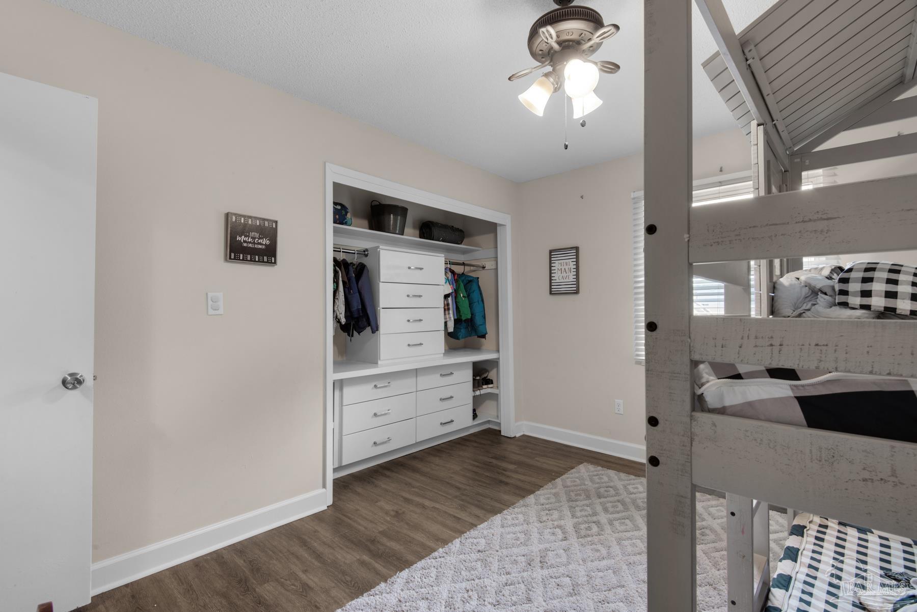 4316 Highland Boulevard Pace, FL 32571 - Photo 24 of 43 a room with a chandelier fan and kitchen view