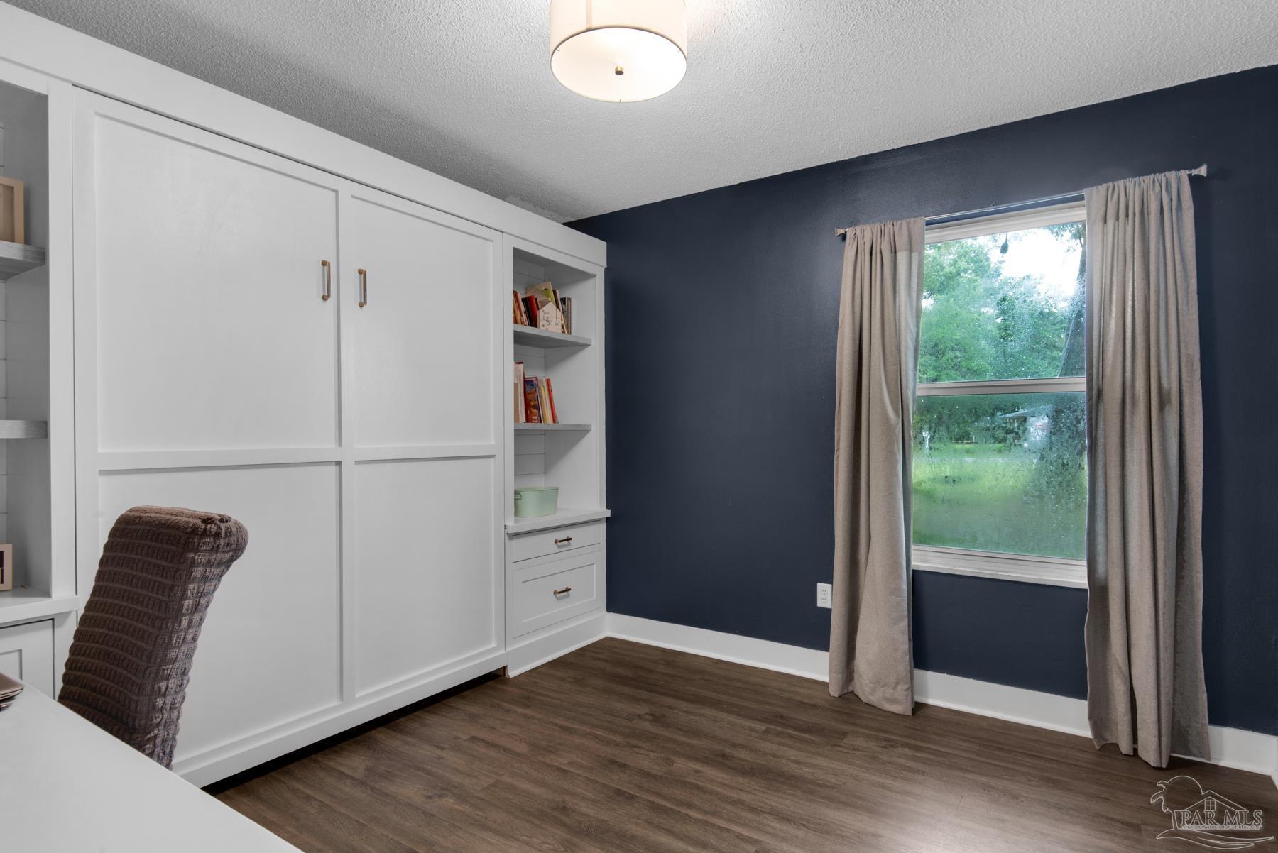 4316 Highland Boulevard Pace, FL 32571 - Photo 26 of 43 a view of hallway with hardwood floor