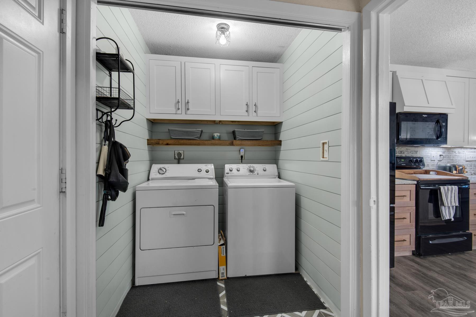 4316 Highland Boulevard Pace, FL 32571 - Photo 31 of 43 a view of storage and utility room with washer and dryer