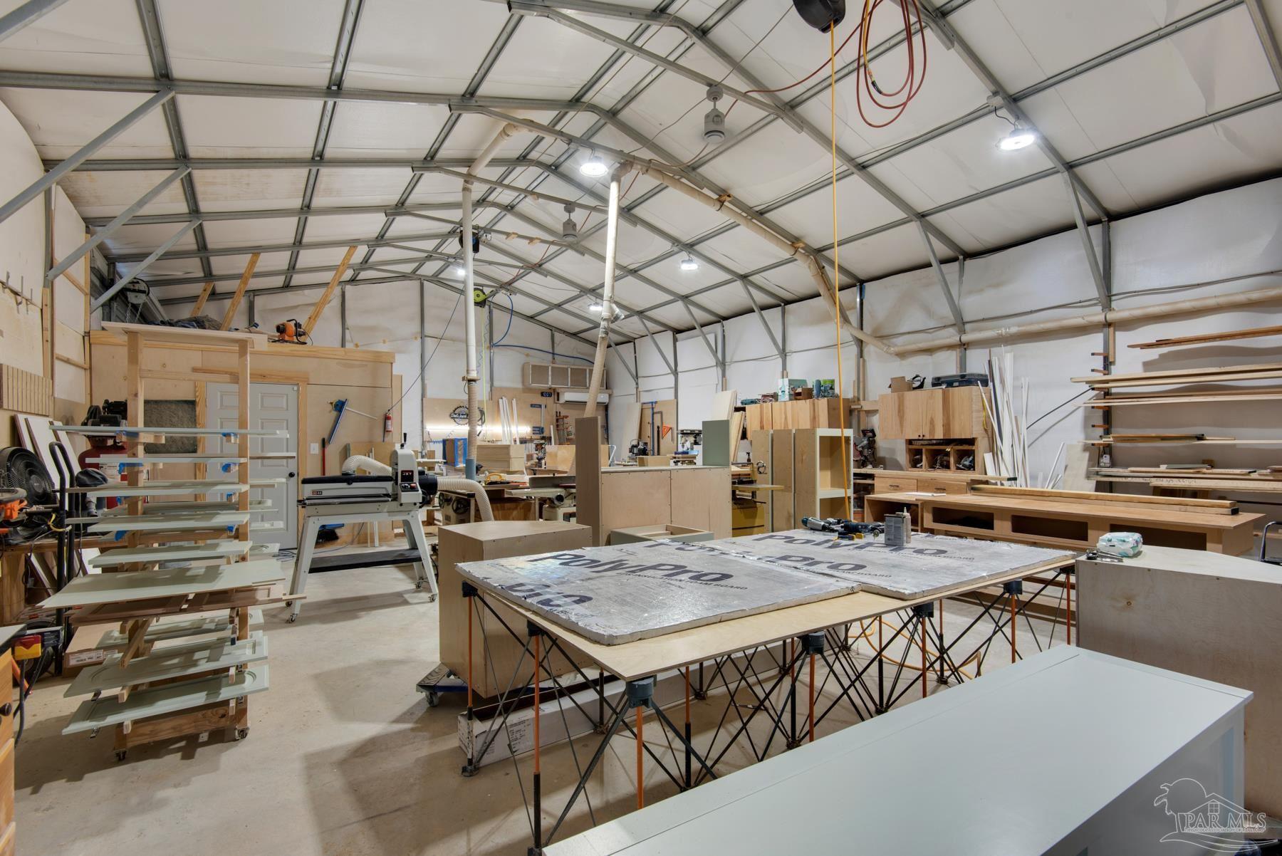 4316 Highland Boulevard Pace, FL 32571 - Photo 41 of 43 a view of a room with gym equipment