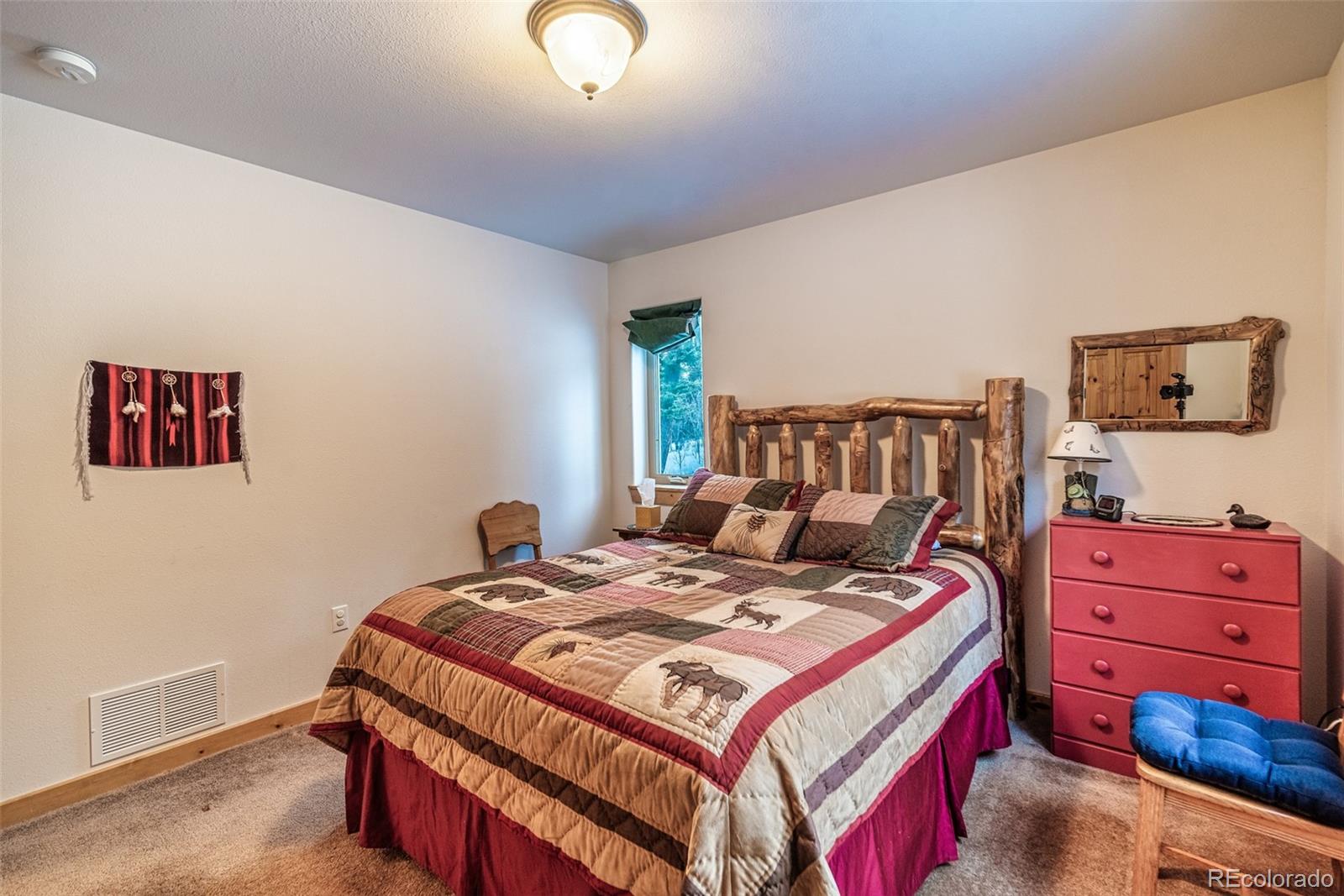 315 Haida Road Como, CO 80456 - Photo 20 of 50 a bedroom with a bed and dresser