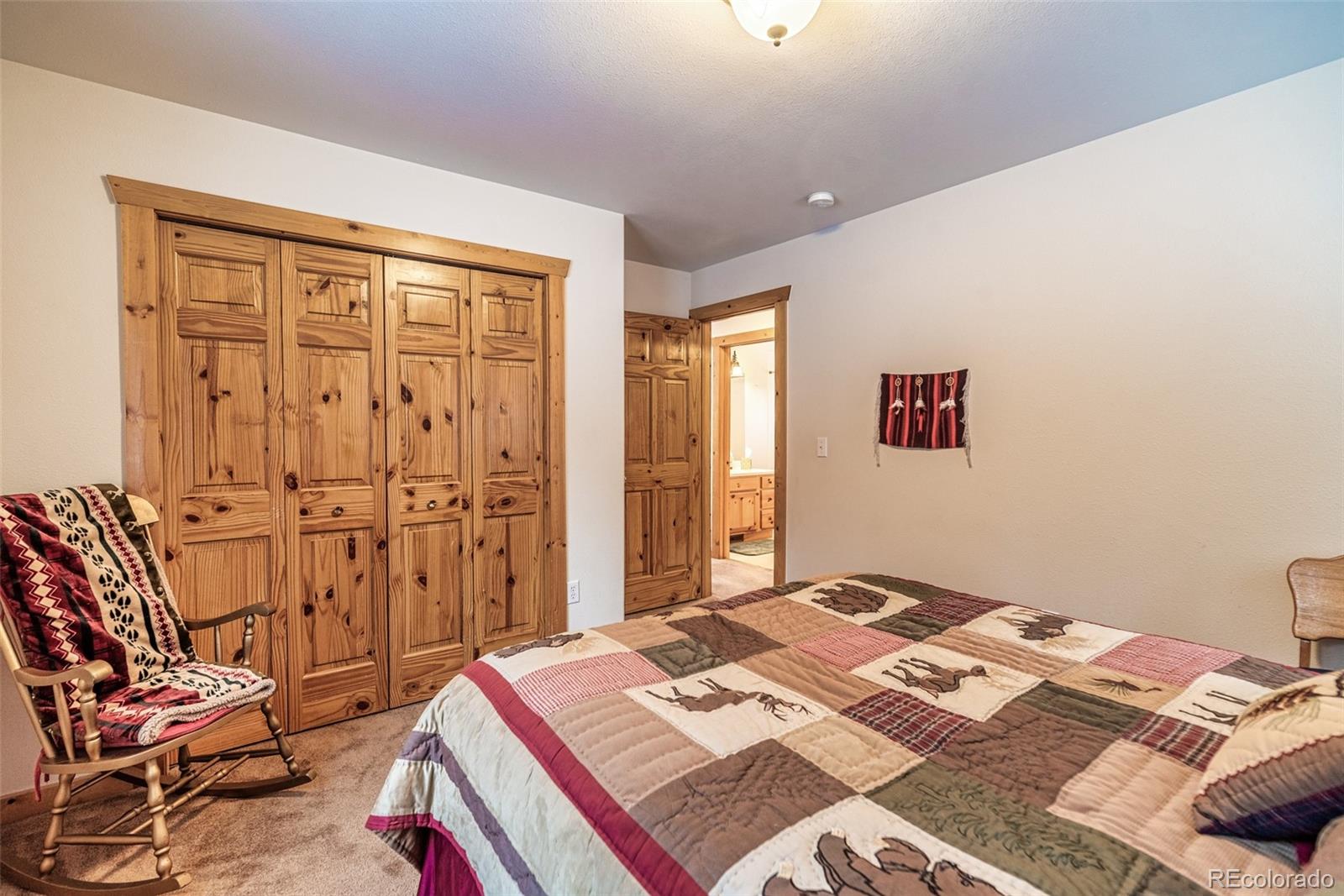 315 Haida Road Como, CO 80456 - Photo 21 of 50 a bedroom with a bed and dresser