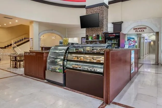 a view of a hallway with seating area