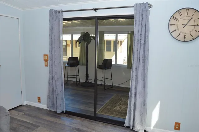 wooden floor with glass door