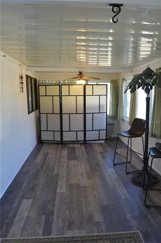 a view of staircase with furniture and window