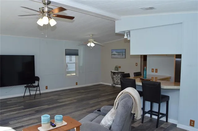 a kitchen with a sink and a mirror