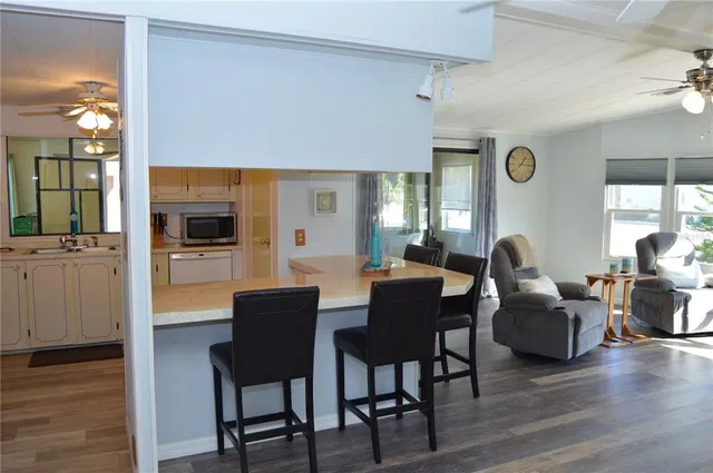 a kitchen with a stove and a refrigerator