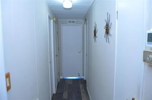 a bedroom with a bed window and a flat screen tv