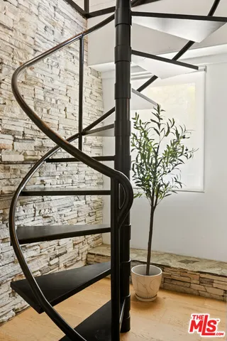 a bedroom with a bed and a cabinets