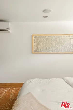 a bathroom with a granite countertop sink a mirror a bathtub and shower