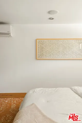 a bathroom with a granite countertop sink a mirror a bathtub and shower