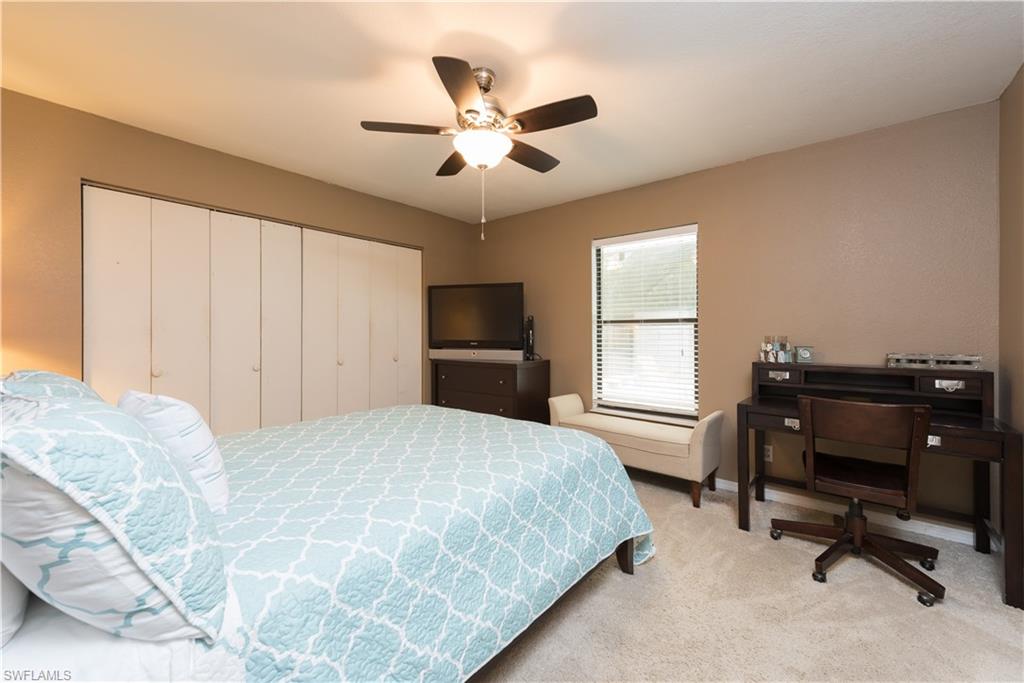 17401 Butler Road Fort Myers, FL 33967 - Photo 17 of 22 a bedroom with a large bed and a window