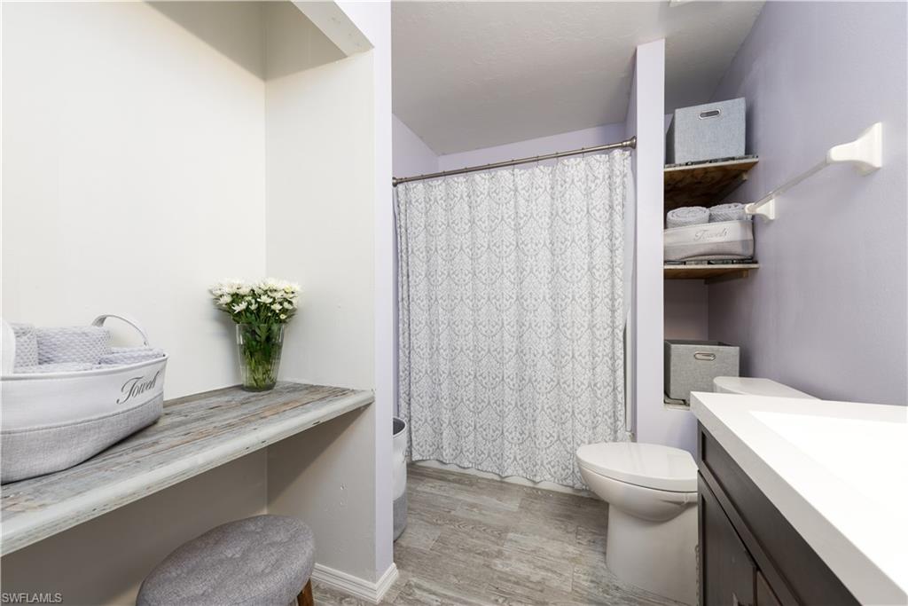 17401 Butler Road Fort Myers, FL 33967 - Photo 19 of 22 a bath room with a toilet and a sink