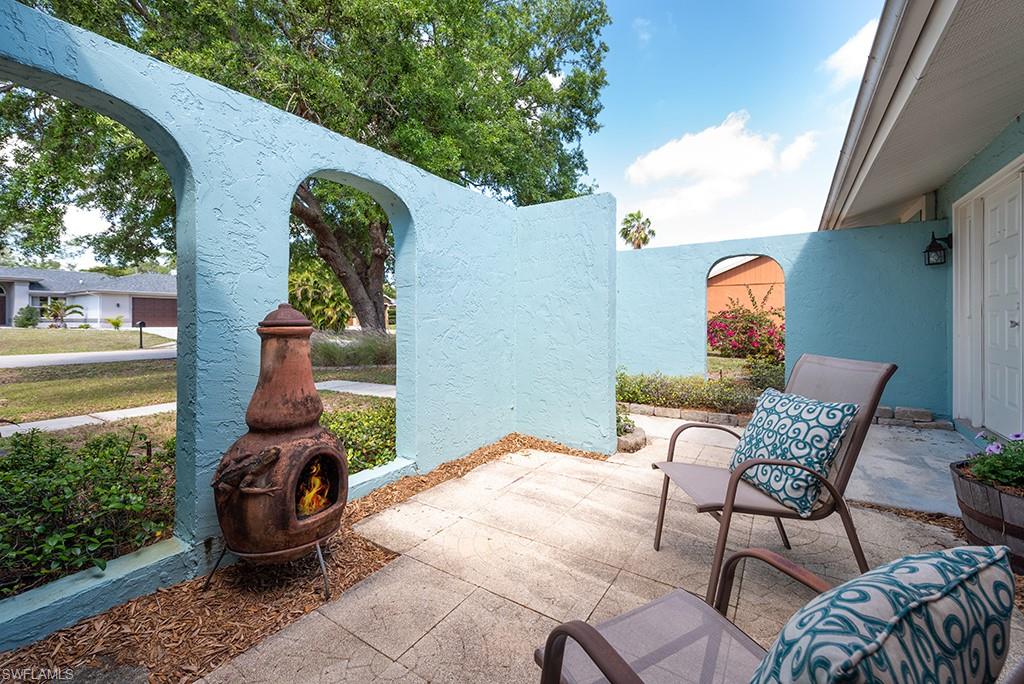 17401 Butler Road Fort Myers, FL 33967 - Photo 3 of 22 a view of a chairs and table in backyard