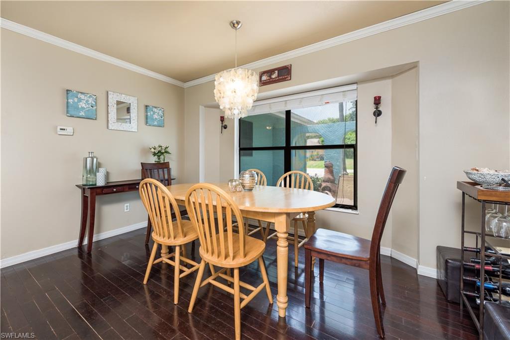17401 Butler Road Fort Myers, FL 33967 - Photo 6 of 22 a view of a dining room with furniture and wooden floor