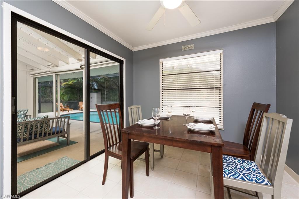 17401 Butler Road Fort Myers, FL 33967 - Photo 10 of 22 a dining room with furniture and a floor to ceiling window