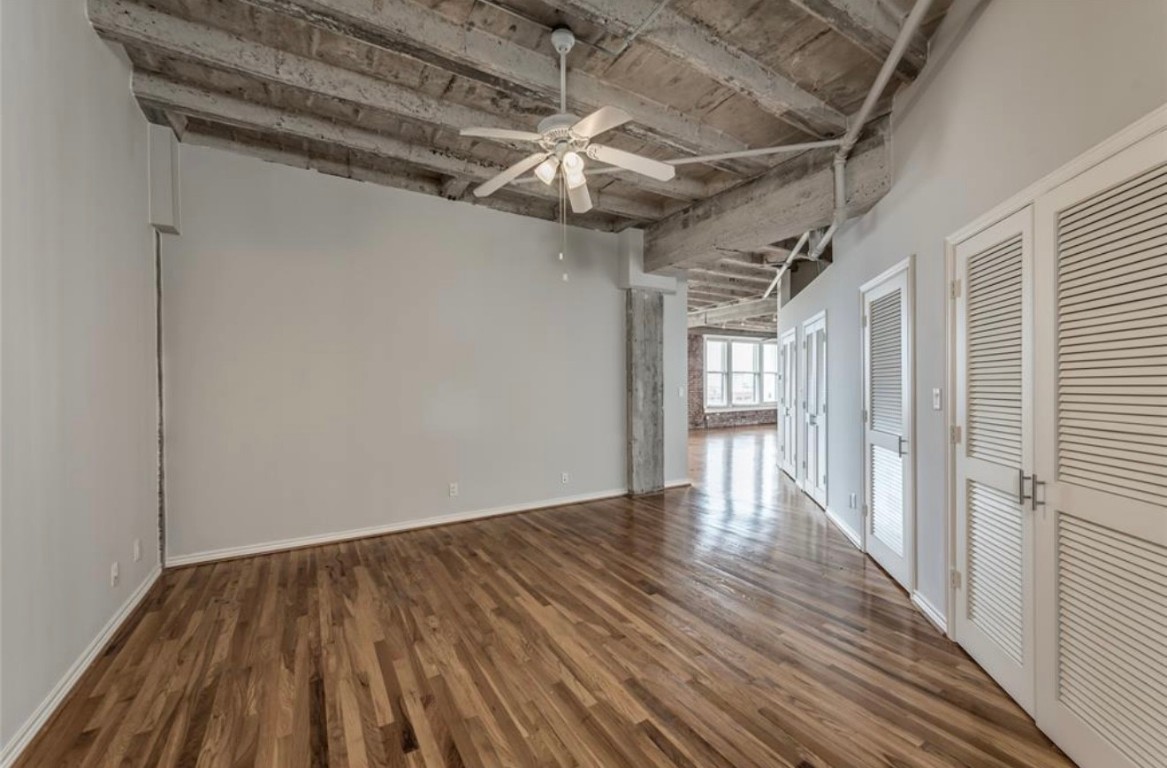 201 Main Street, Unit 6G Houston, TX 77002 - Photo 6 of 14 The primary bedroom stays true to the loft design with no doors, maintaining a seamless flow throughout the home.