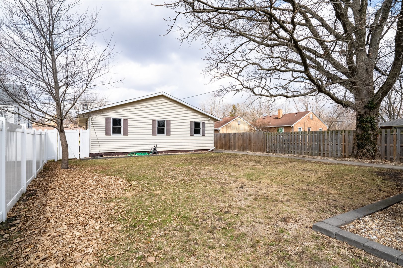 409 East Delaware Street Dwight, IL 60420 - Photo 28 of 31 a backyard of a house with a large tree