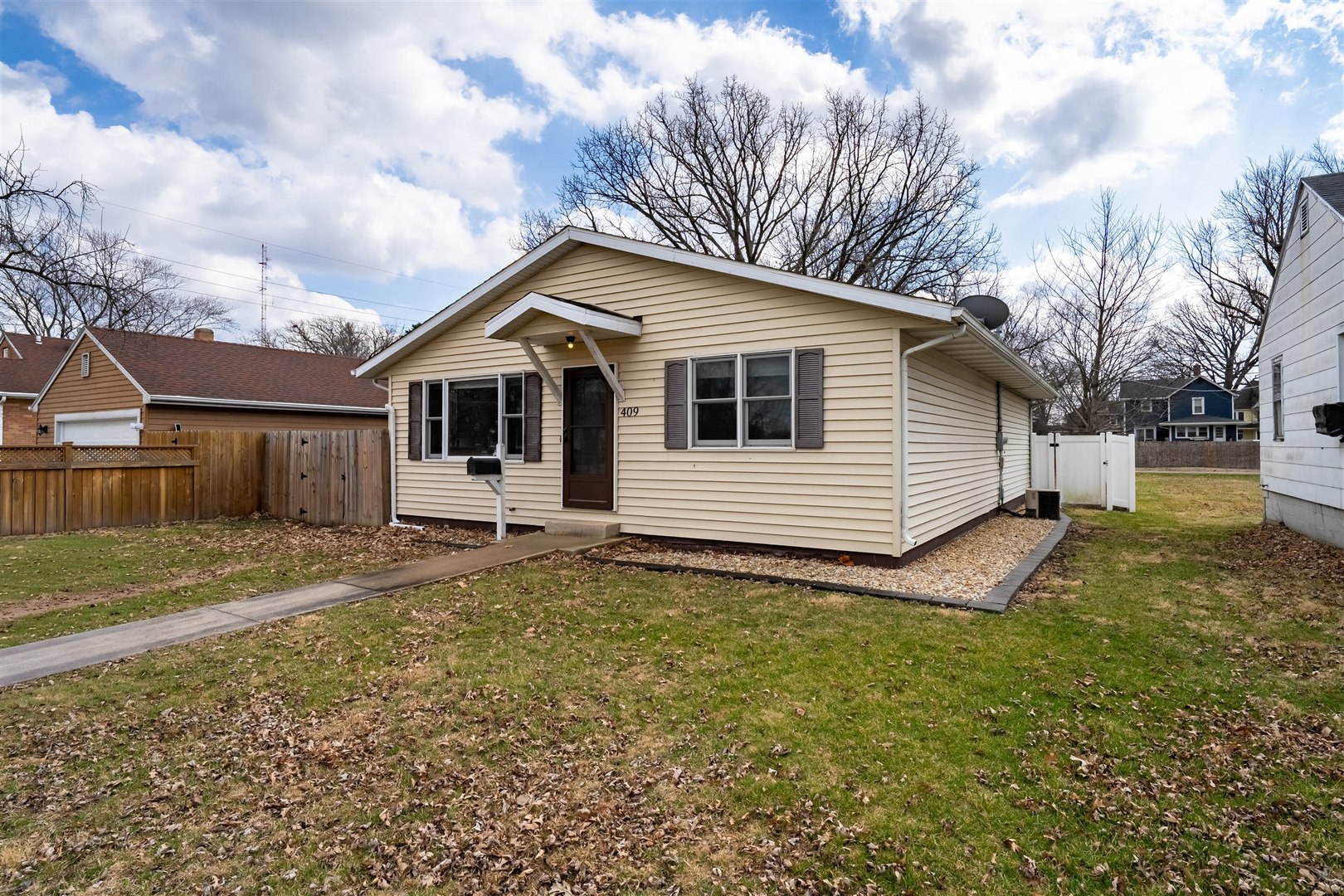 409 East Delaware Street Dwight, IL 60420 - Photo 31 of 31 a white house that has a tree in front of it