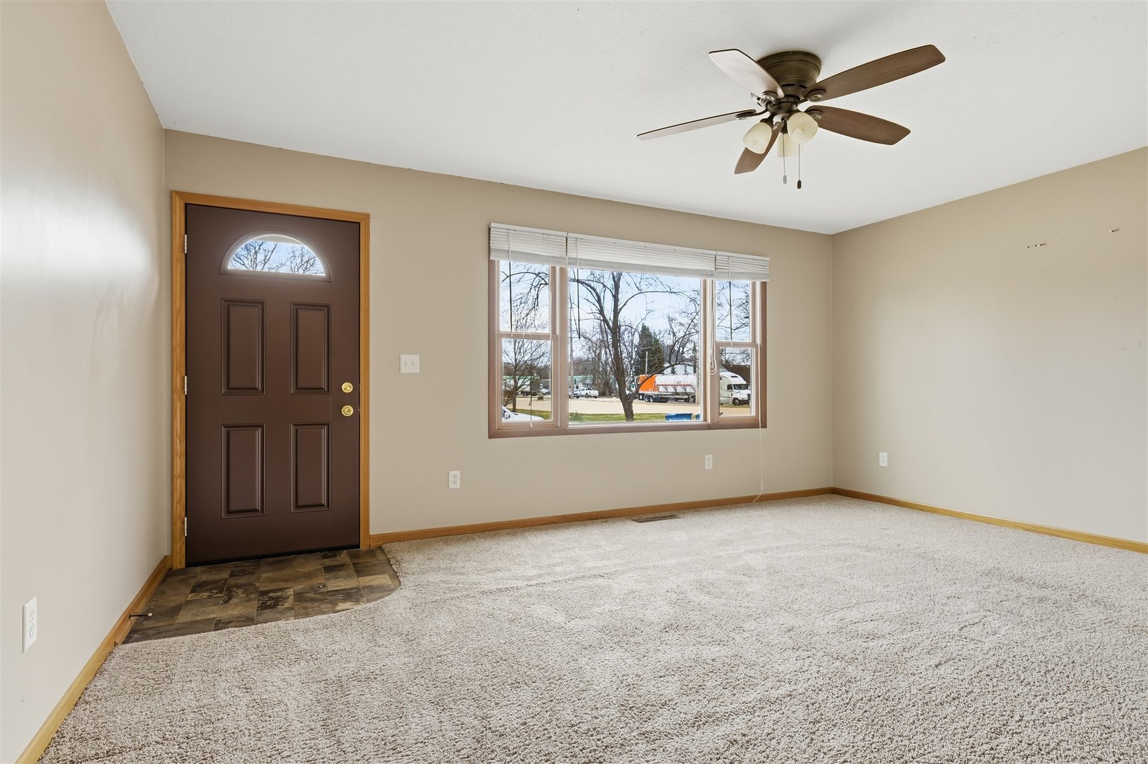409 East Delaware Street Dwight, IL 60420 - Photo 5 of 31 a view of an empty room with a window