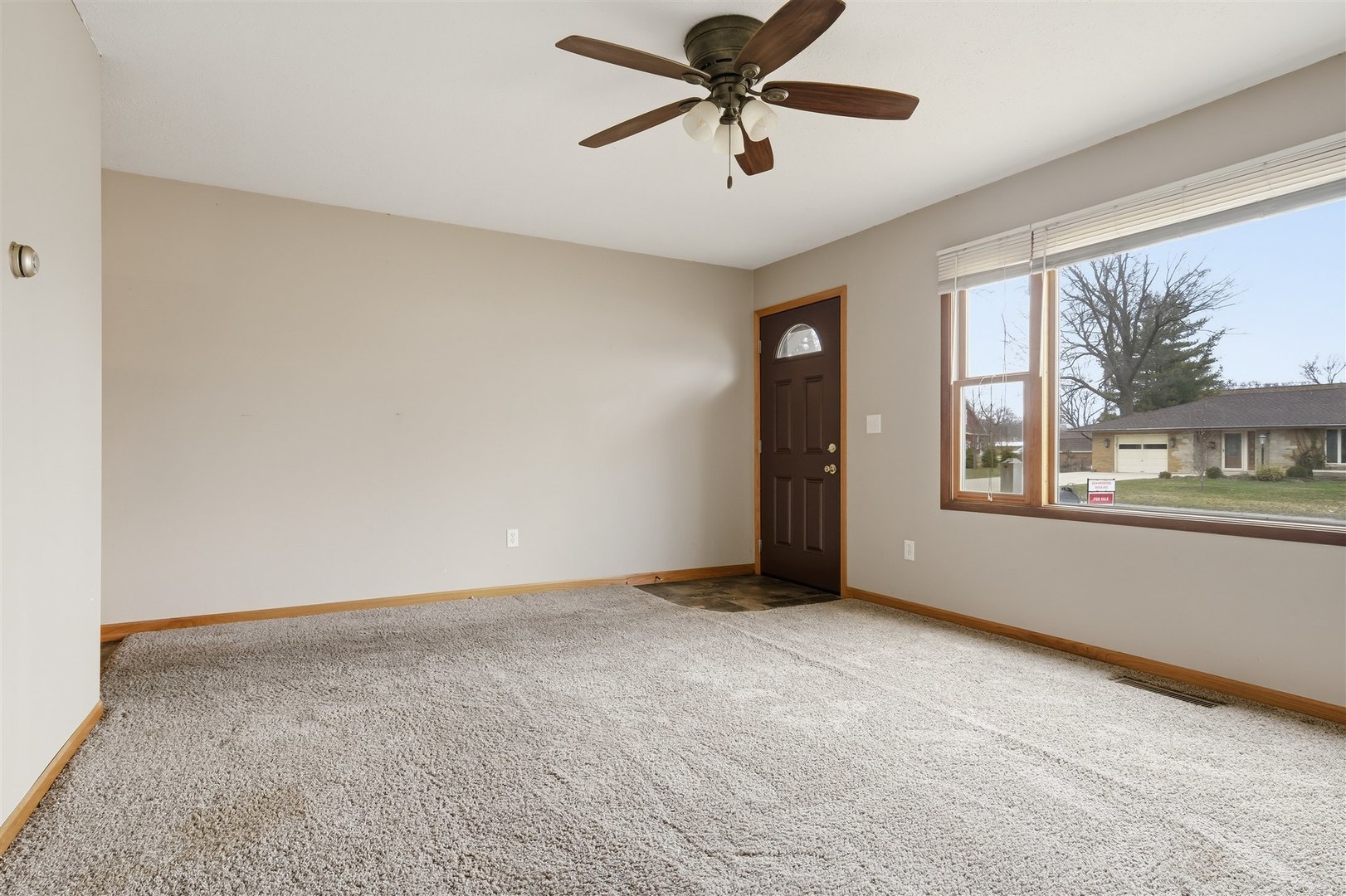 409 East Delaware Street Dwight, IL 60420 - Photo 6 of 31 a view of an empty room with a window