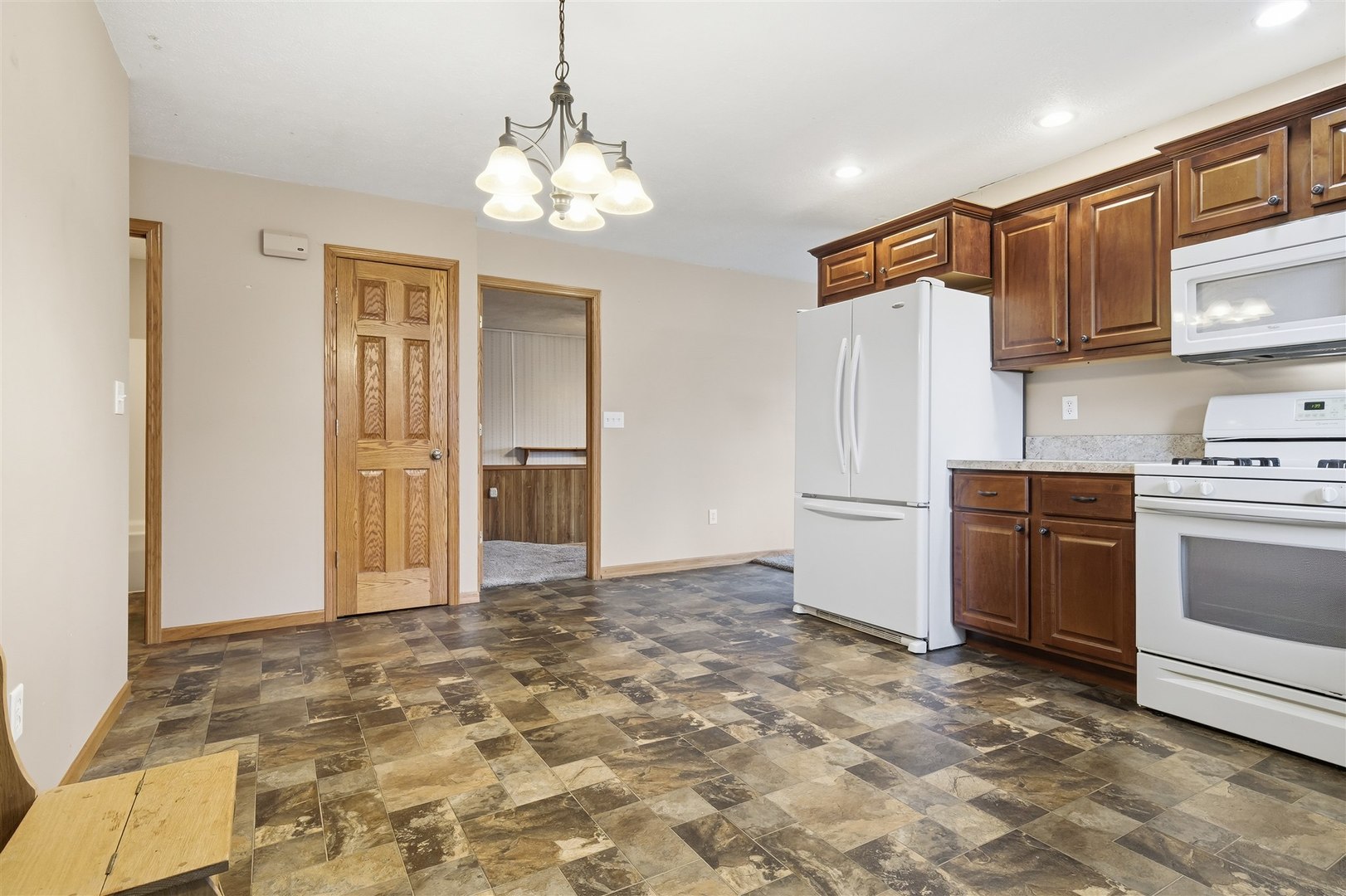 409 East Delaware Street Dwight, IL 60420 - Photo 10 of 31 a view of a kitchen with a sink and a refrigerator