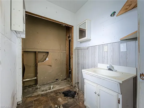 a bathroom with a sink and a mirror
