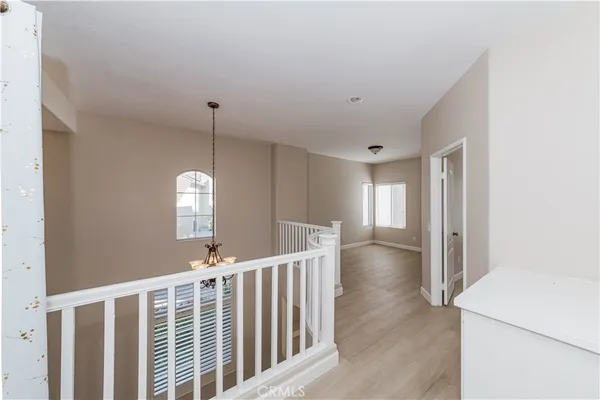 a view of a hallway with windows