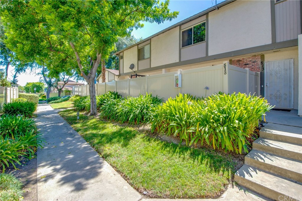 513 D Street, Unit 53 Upland, CA 91786 - Photo 1 of 25 a front view of a house with a yard