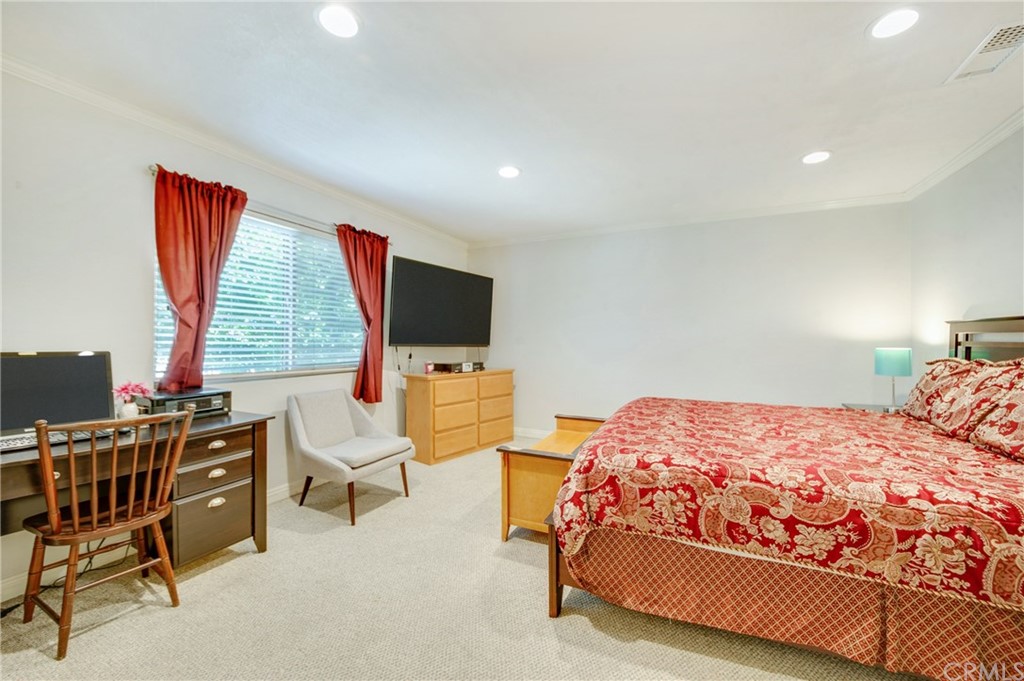 513 D Street, Unit 53 Upland, CA 91786 - Photo 11 of 25 a bedroom with a bed tv and chair