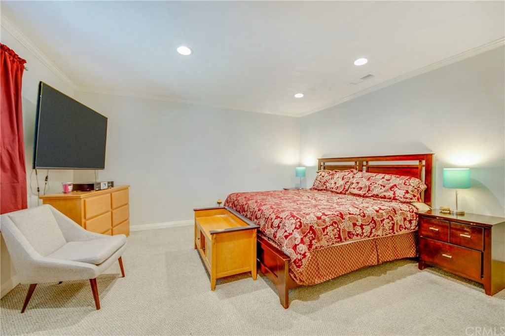 513 D Street, Unit 53 Upland, CA 91786 - Photo 12 of 25 a bedroom with a bed and a flat screen tv
