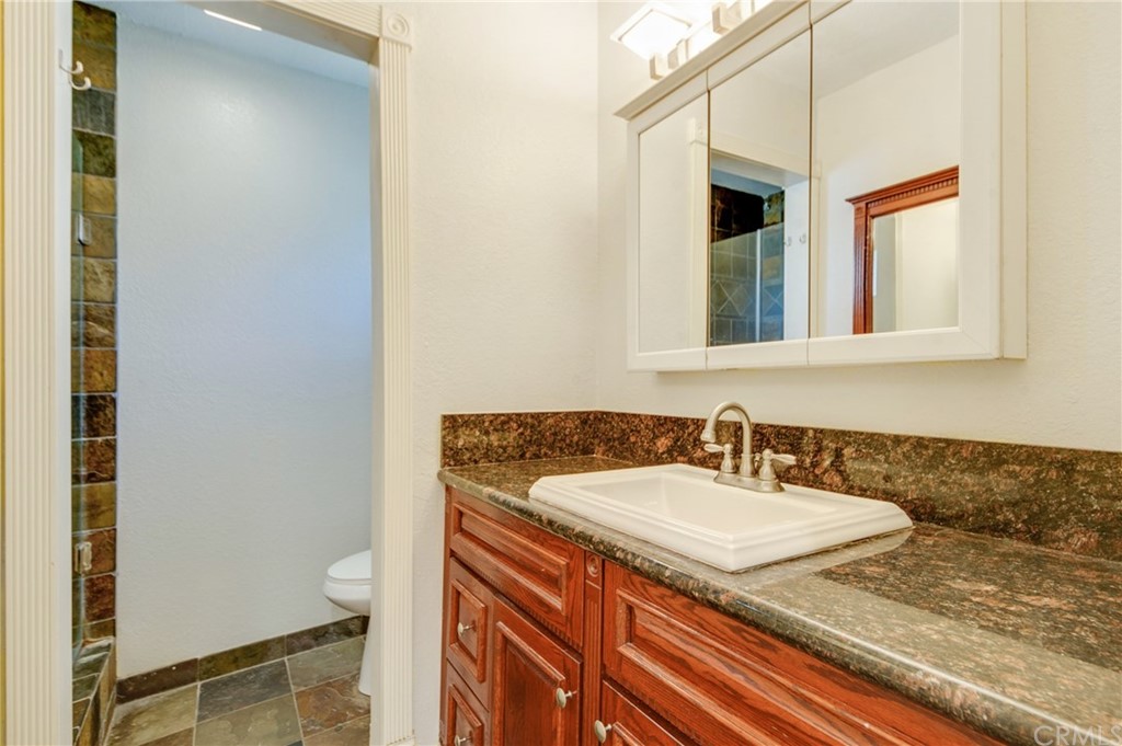 513 D Street, Unit 53 Upland, CA 91786 - Photo 14 of 25 a bathroom with a sink and a mirror