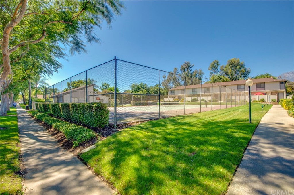 513 D Street, Unit 53 Upland, CA 91786 - Photo 22 of 25 a view of a garden with a bench