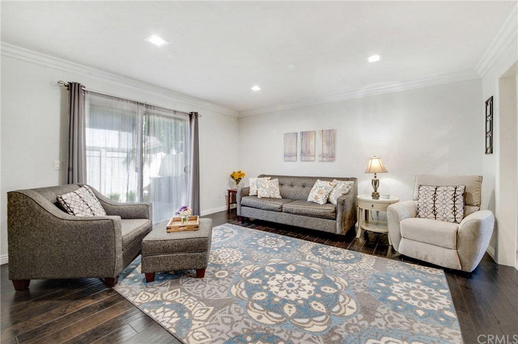 513 D Street, Unit 53 Upland, CA 91786 - Photo 3 of 25 a living room with furniture and a large window