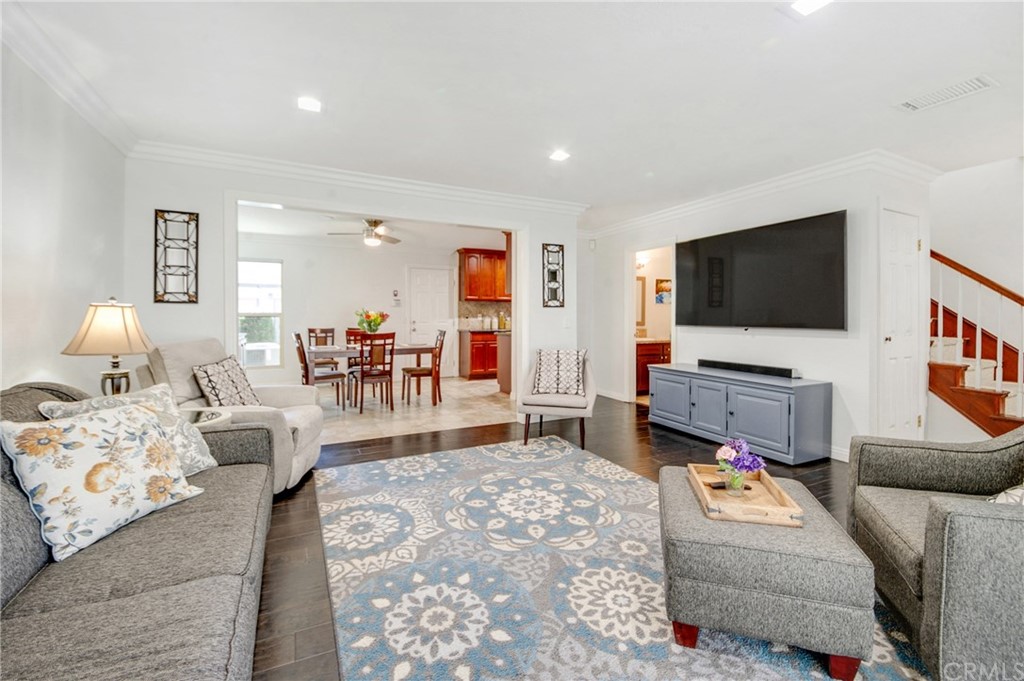513 D Street, Unit 53 Upland, CA 91786 - Photo 5 of 25 a living room with furniture and a flat screen tv