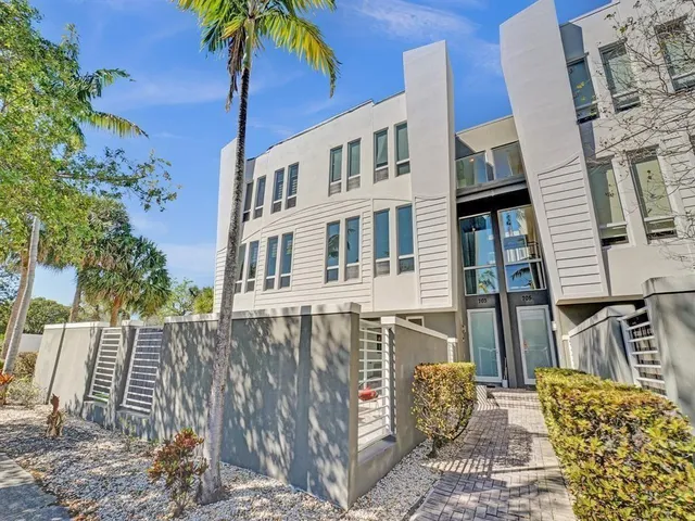 a front view of a house with parking space