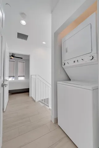 a view of hallway with washer and dryer